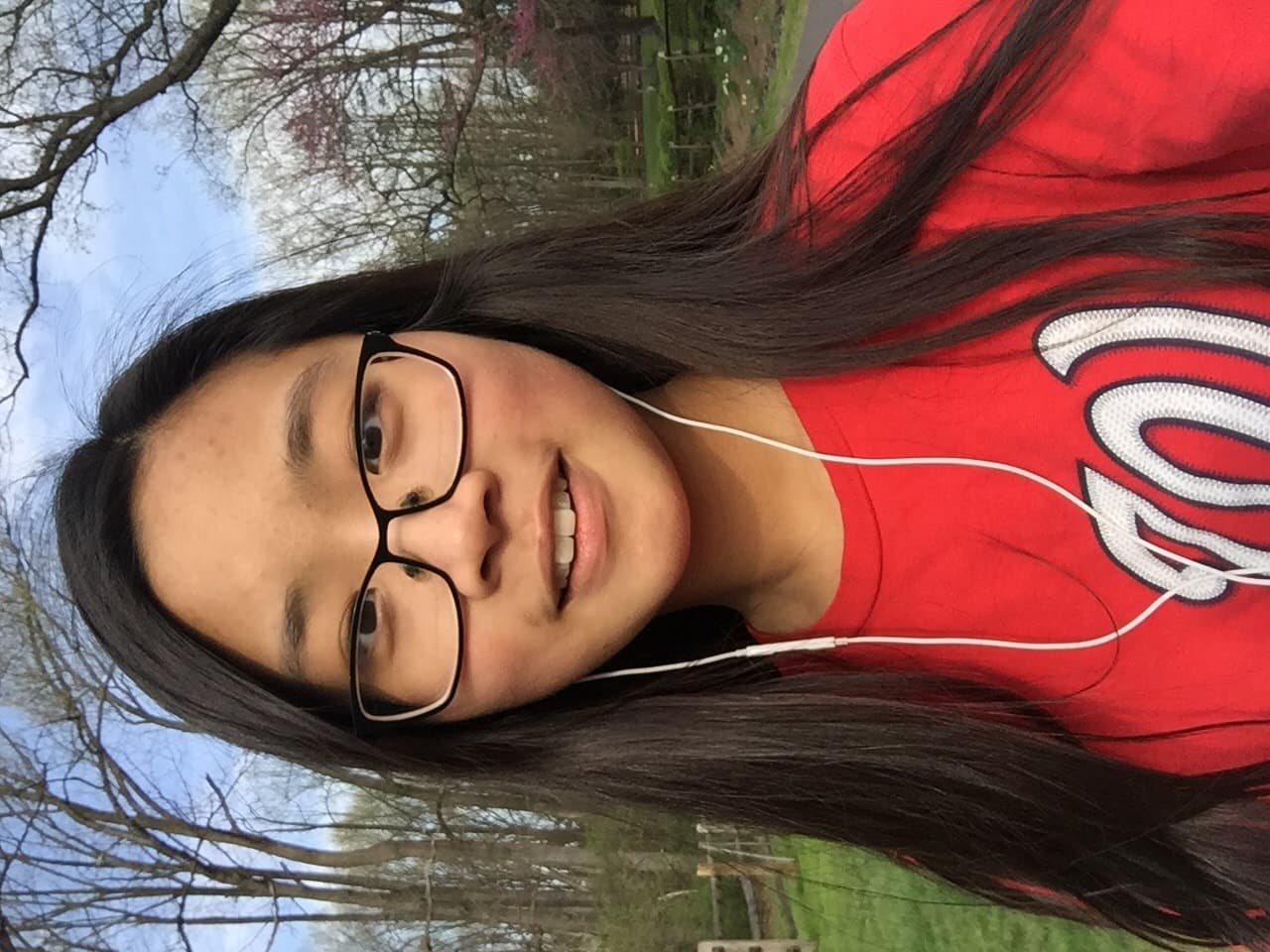 walking in neighborhood wearing red